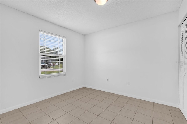3685 Sunday Dr, Deltona, FL 32738 - spare room with a textured ceiling and baseboards