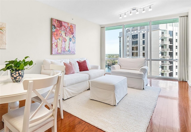 322 E Central Blvd Unit 1612, Orlando, FL 32801 - living room featuring wood finished floors and floor to ceiling windows