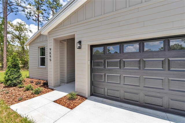 9695 SW 125 Court Rd, Dunnellon, FL 34432 - garage featuring concrete driveway