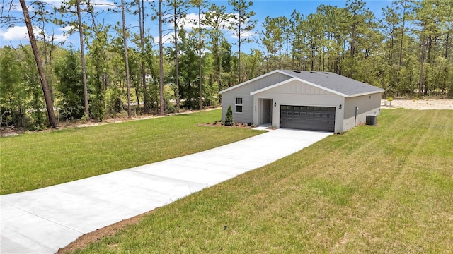 9695 SW 125 Court Rd, Dunnellon, FL 34432 - view of front facade with a front lawn, central AC unit, and concrete driveway