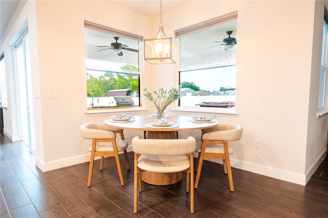 dining room with baseboards, dark wood-style floors, and a ceiling fan