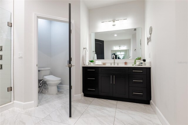 bathroom with a stall shower, toilet, vanity, marble finish floors, and baseboards