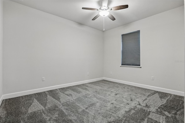 empty room featuring baseboards, carpet, and a ceiling fan
