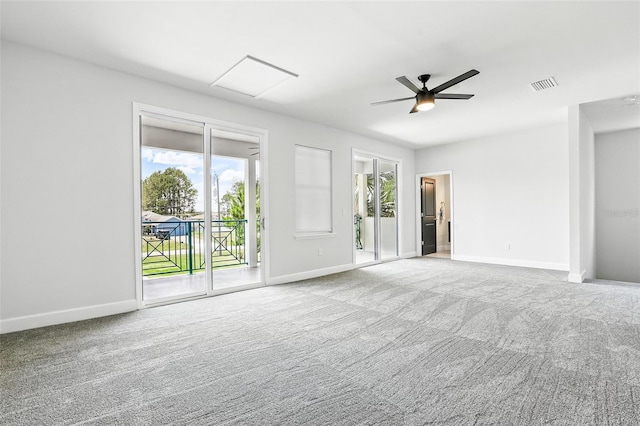 unfurnished living room with carpet flooring, baseboards, and ceiling fan