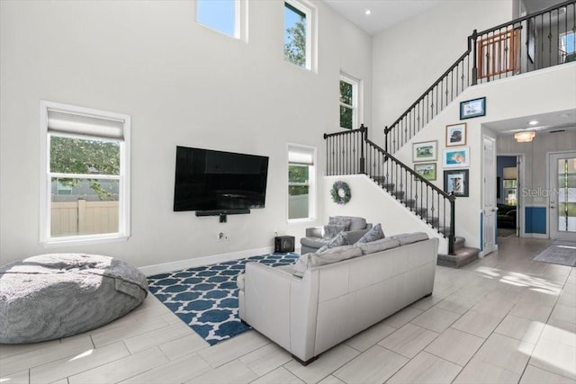 14639 Winter Stay Dr, Winter Garden, FL 34787 - living area with a high ceiling, plenty of natural light, and stairway