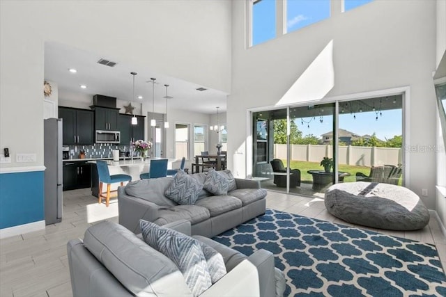 14639 Winter Stay Dr, Winter Garden, FL 34787 - living room with a towering ceiling, recessed lighting, and baseboards