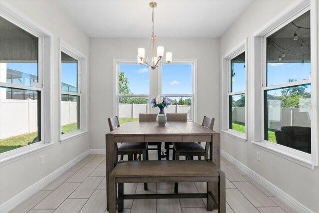 14639 Winter Stay Dr, Winter Garden, FL 34787 - dining space featuring plenty of natural light, a chandelier, and baseboards