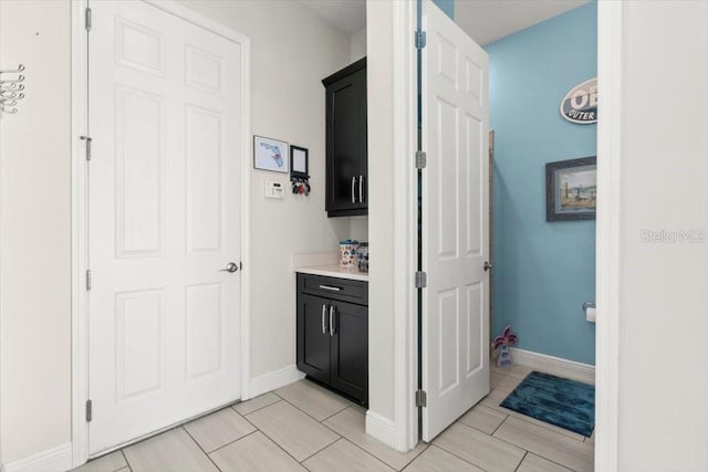 14639 Winter Stay Dr, Winter Garden, FL 34787 - bathroom with baseboards, tile patterned flooring, and vanity