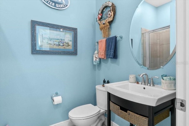 14639 Winter Stay Dr, Winter Garden, FL 34787 - bathroom with baseboards, toilet, a shower, and a sink
