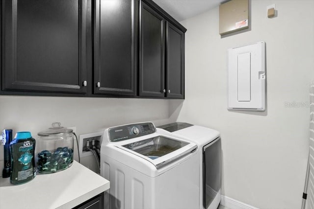 14639 Winter Stay Dr, Winter Garden, FL 34787 - laundry area featuring washer and clothes dryer, cabinet space, electric panel, and baseboards