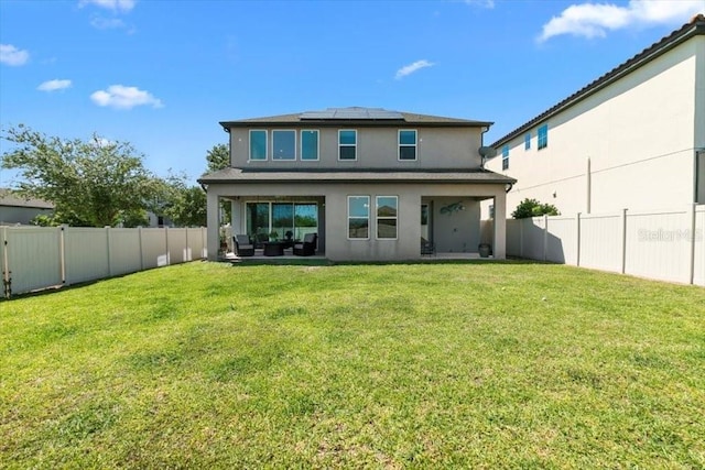 14639 Winter Stay Dr, Winter Garden, FL 34787 - back of property with solar panels and stucco siding