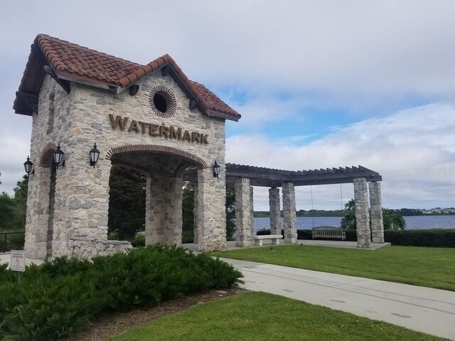 14639 Winter Stay Dr, Winter Garden, FL 34787 - view of property's community with a lawn, a pergola, and a water view
