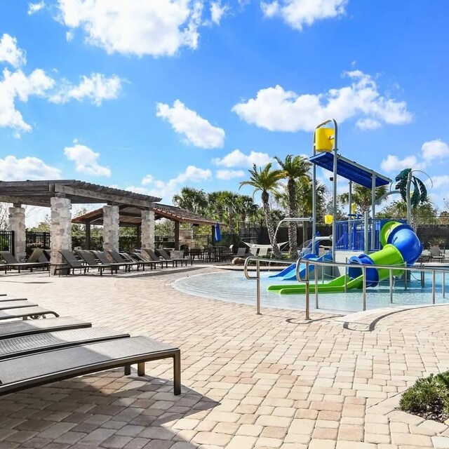 14639 Winter Stay Dr, Winter Garden, FL 34787 - community jungle gym with a water play area and a pergola