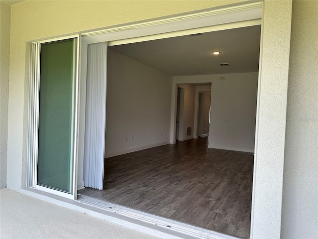 property entrance with stucco siding