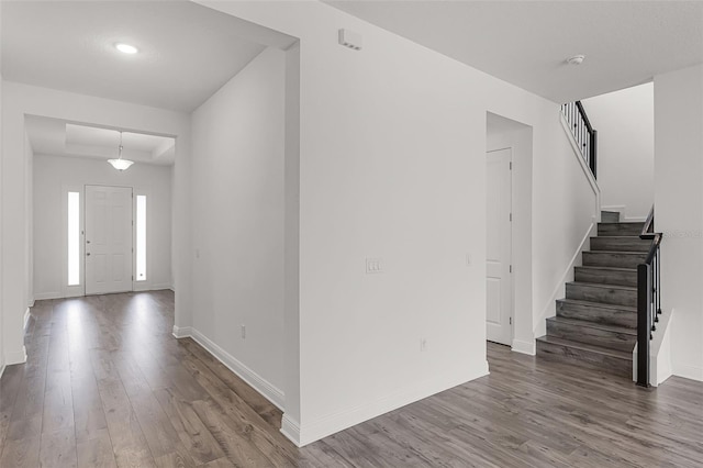 15161 Lake Bessie Loop, Winter Garden, FL 34787 - foyer entrance with wood finished floors, stairs, and baseboards
