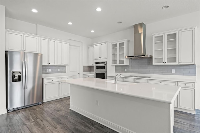 15161 Lake Bessie Loop, Winter Garden, FL 34787 - kitchen with stainless steel appliances, wall chimney range hood, a sink, white cabinets, and recessed lighting