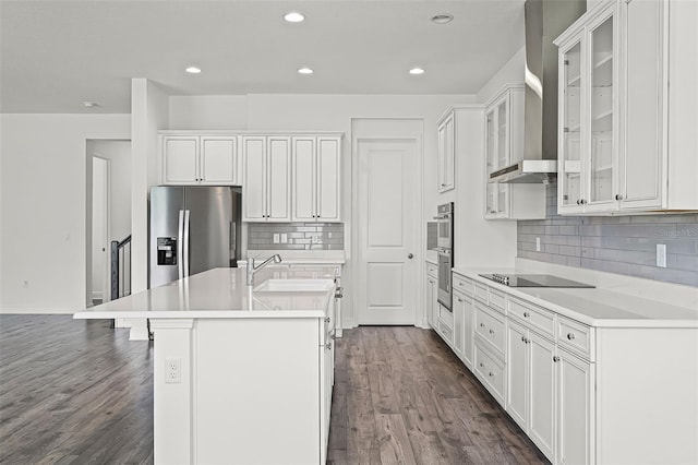 15161 Lake Bessie Loop, Winter Garden, FL 34787 - kitchen with stainless steel appliances, wall chimney range hood, an island with sink, dark wood-style floors, and recessed lighting