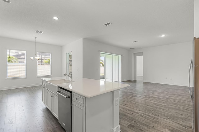 15161 Lake Bessie Loop, Winter Garden, FL 34787 - kitchen featuring a sink, stainless steel dishwasher, baseboards, dark wood finished floors, and recessed lighting