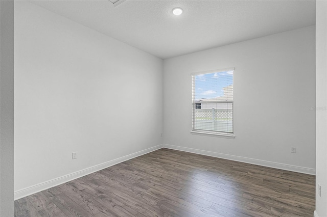 15161 Lake Bessie Loop, Winter Garden, FL 34787 - empty room featuring dark wood finished floors and baseboards