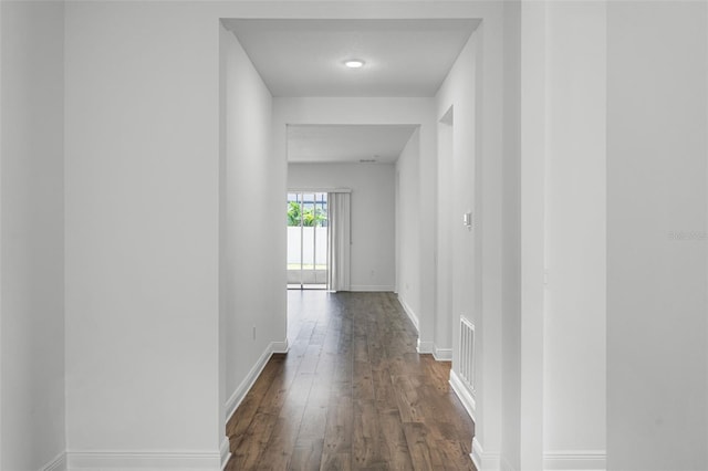15161 Lake Bessie Loop, Winter Garden, FL 34787 - hall featuring dark wood-style floors and baseboards