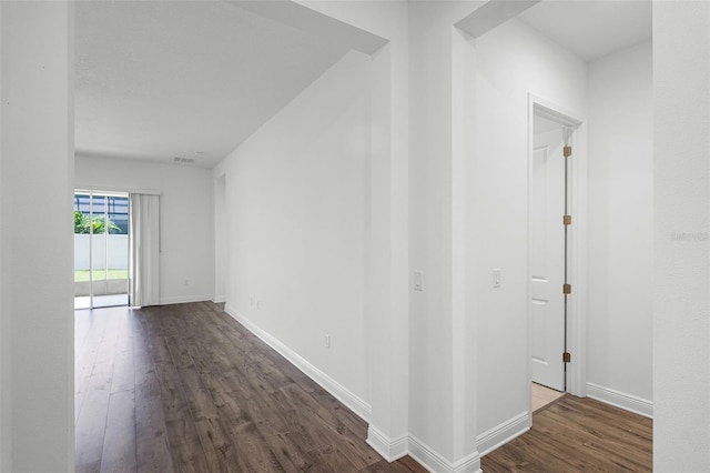 15161 Lake Bessie Loop, Winter Garden, FL 34787 - hallway featuring dark wood-style flooring and baseboards