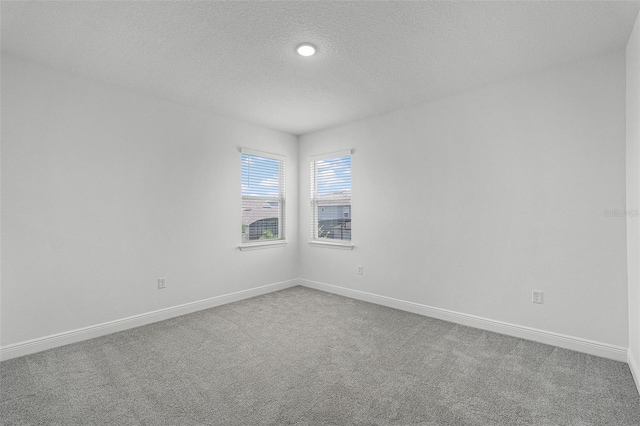 15161 Lake Bessie Loop, Winter Garden, FL 34787 - unfurnished room with carpet, baseboards, a textured ceiling, and recessed lighting