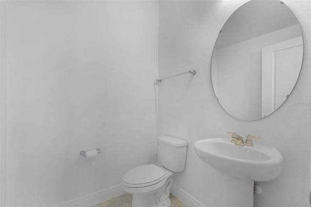 15161 Lake Bessie Loop, Winter Garden, FL 34787 - half bathroom with toilet, baseboards, and tile patterned flooring