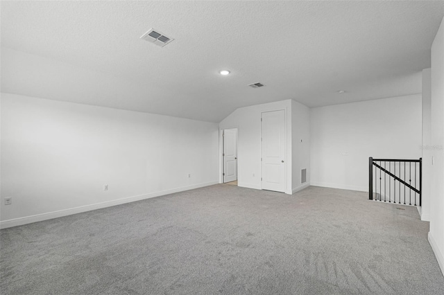 15161 Lake Bessie Loop, Winter Garden, FL 34787 - bonus room featuring carpet floors, baseboards, vaulted ceiling, a textured ceiling, and recessed lighting