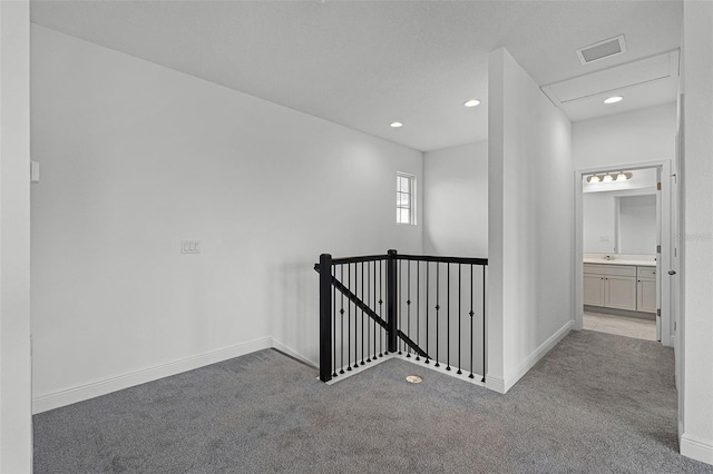 15161 Lake Bessie Loop, Winter Garden, FL 34787 - hallway with carpet, an upstairs landing, recessed lighting, and baseboards