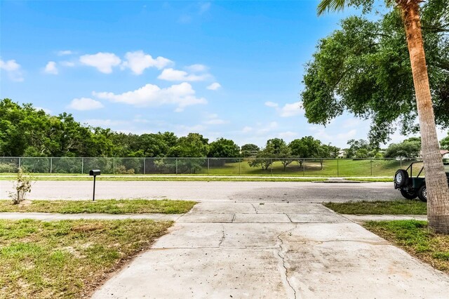 7085 Willowwood St, Orlando, FL 32818 - view of concrete surface featuring sidewalks