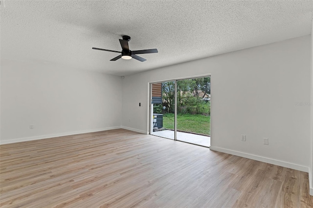 7085 Willowwood St, Orlando, FL 32818 - unfurnished room with a textured ceiling, light wood-type flooring, a ceiling fan, and baseboards