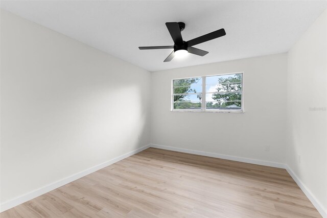 7085 Willowwood St, Orlando, FL 32818 - spare room with light wood-type flooring, baseboards, and a ceiling fan