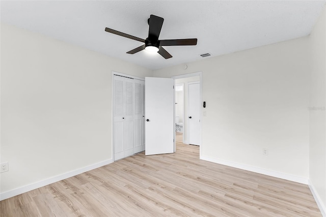 7085 Willowwood St, Orlando, FL 32818 - unfurnished bedroom featuring wood finished floors, baseboards, a closet, and ceiling fan
