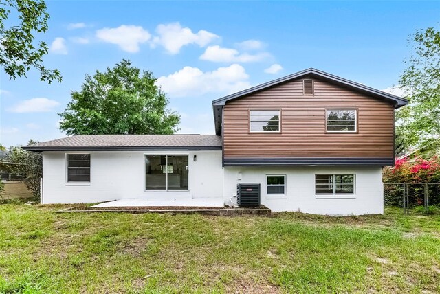 7085 Willowwood St, Orlando, FL 32818 - back of house with a patio and cooling unit