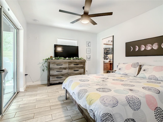bedroom featuring access to outside, a ceiling fan, baseboards, and light wood-style flooring