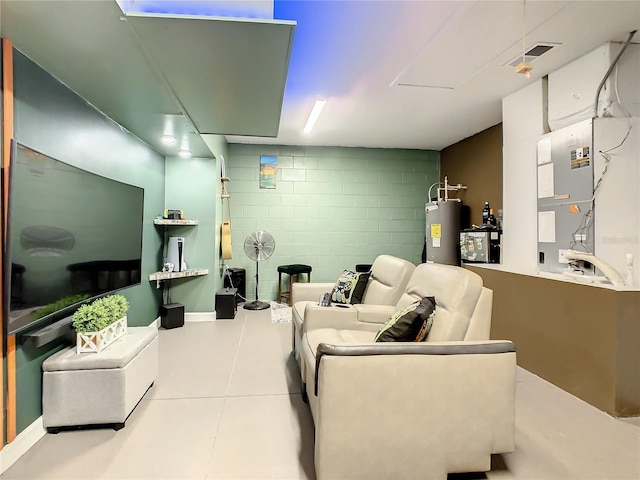 living room featuring electric water heater, heating unit, and tile patterned floors
