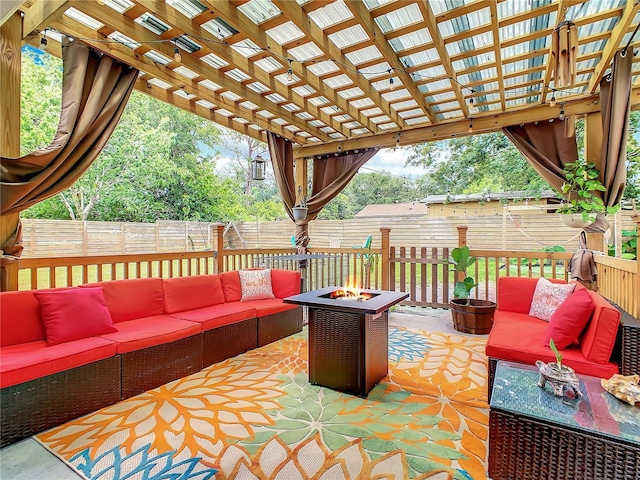 view of patio featuring an outdoor living space with a fire pit, a fenced backyard, and a pergola