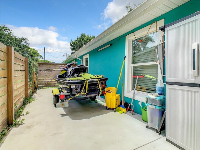 view of patio featuring fence