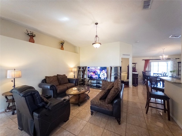 212 Ashford Dr, Davenport, FL 33837 - tiled living room with a chandelier