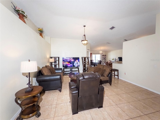 212 Ashford Dr, Davenport, FL 33837 - living room featuring light tile patterned floors, baseboards, and a chandelier