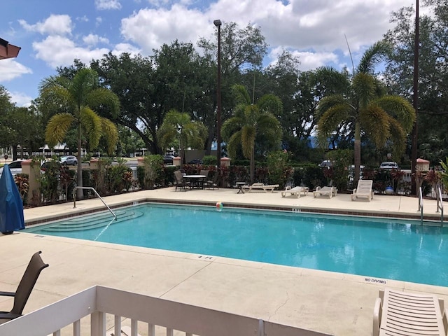 community pool featuring a patio area