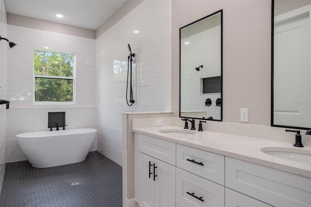 12460 SW 48 Lane Rd, Ocala, FL 34481 - full bathroom with double vanity, a soaking tub, tiled shower, tile patterned floors, and tile walls