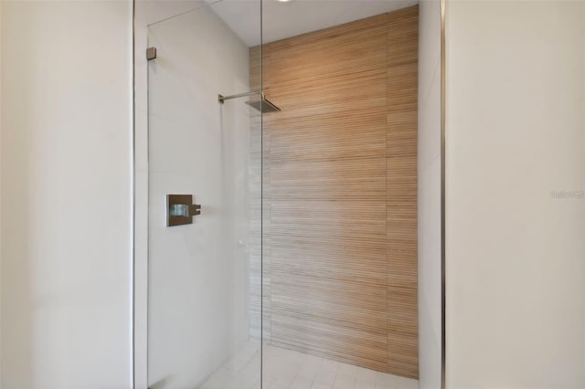 bathroom with a tile shower