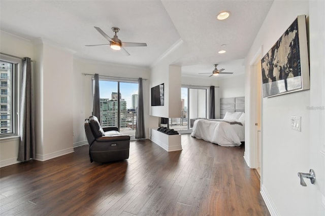 bedroom featuring dark wood-type flooring, crown molding, access to exterior, baseboards, and recessed lighting