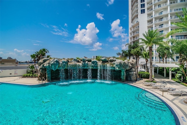 community pool featuring a patio area and a pergola