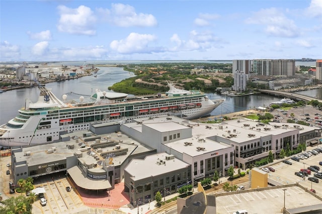view of urban area featuring a nearby body of water and a notable bridge