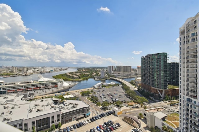 view of urban area featuring a nearby body of water and a notable bridge