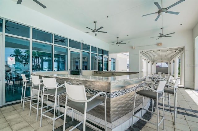 view of patio featuring ceiling fan