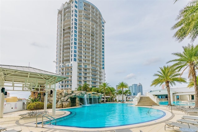 community pool with a patio area