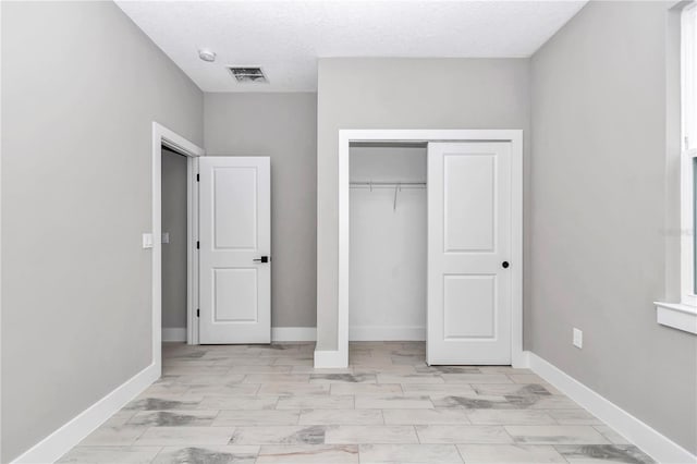 12197 SW 76th Ln, Dunnellon, FL 34432 - unfurnished bedroom with a closet and baseboards
